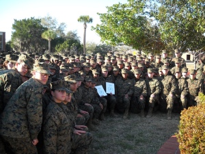 Women Marines of Platoons 4004 and 4005 take a knee for a photo with their Molly Marines.